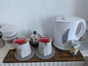 a counter with two coffee makers and a mixer at Areawest in Scarborough