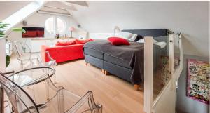 a bedroom with a bed and a living room at Seawiew in Helsingborg