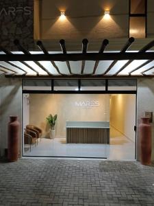a store front with a large glass door at Pousada Mares Maragogi in Maragogi