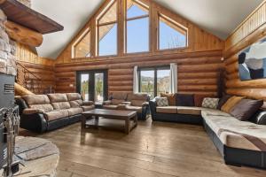 a living room with couches and a table at Private Pool - Spa - Pool Table - Le St-Come in Saint Come +52 photos