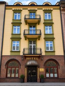 a hotel with two balconies on a building at Hotel Kazimierz in Krakow