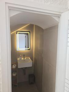 a bathroom with a sink and a mirror at Villa Timea Piscina e Tennis Vista Isole Egadi in Marsala +12 photos