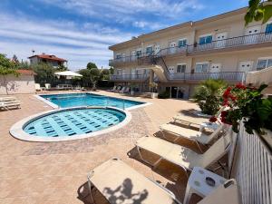 a swimming pool in front of a hotel at Brother's House in Kallithea Halkidikis +52 photos