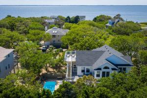 an aerial view of a house and the ocean at Oceanside retreat with pool & spa June Weeks Open in Sanderling