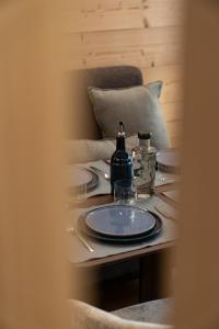 a table with a blue plate and glasses on it at Balmoral in Champéry +23 photos
