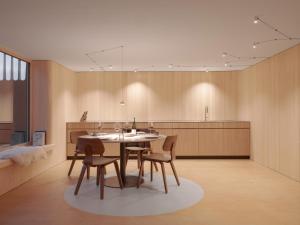 a dining room with a table and chairs and a kitchen at Haus des Onkels in Hittisau +44 photos