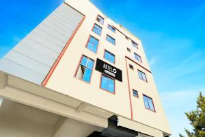a building with a hotel sign on it at Hotel O Anantapur in Anantapur +40 photos