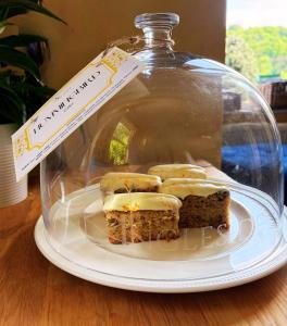 a plate with a glass jar with some food on it at Ingleside in Lynton +34 photos