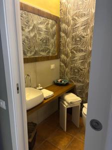 a bathroom with a sink and a toilet at Storico in Como +45 photos