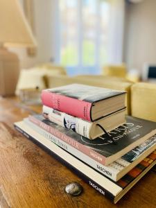 three books stacked on top of each other on a table at L'escale vosgienne in Saint Die