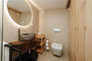 a bathroom with a sink and a toilet at Casa Ti Nogueira in Soajo +7 photos