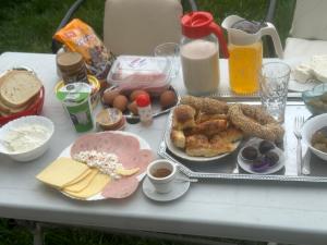 a table with a tray of breakfast foods and drinks at Camping Struga Macedonia in Struga