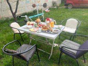 a table with food on it in the grass at Camping Struga Macedonia in Struga