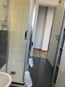 a bathroom with a shower and a sink at Vittorino house in Polignano a Mare +40 photos