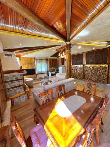 a living room with a table and a couch at Forest Home 2 in Železnička Stanica )) (( Gornja Plavnica
