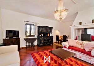 a living room with a couch and a table at MyStay - Monte dos Abrunhos in Vimieiro