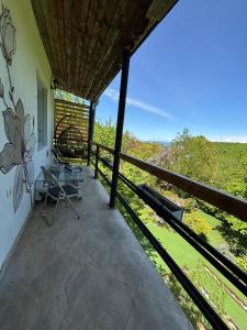 a balcony of a house with a view at Shin Boutique Hotel with Mini Golf Terrace in Buriaki +81 photos
