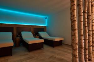 Łóżko lub łóżka w pokoju w obiekcie Hotel Zontaja Superior