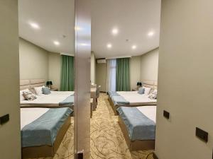 a row of beds in a hospital room at Aurora Hotel Batumi in Batumi