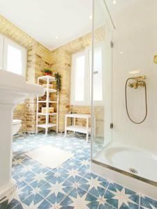 a bathroom with a shower and a tub at Fiore Kampielo Apartment in Corfu +34 photos