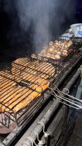 a grill with a bunch of food on it at Vista Guest House in Yaremche