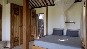 Ένα ή περισσότερα κρεβάτια σε δωμάτιο στο The Mayana Beach House +16 φωτογραφίες