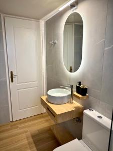 a bathroom with a sink and a mirror at Vstay Residence 2 - near Airport & Beach in Artemida +13 photos