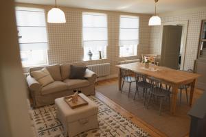 a living room with a couch and a table at JETHON Appartement am Wasserturm 1 in Nienburg
