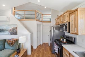 a kitchen with a couch and a stove top oven at Huckleberry Inn in Custer +12 photos