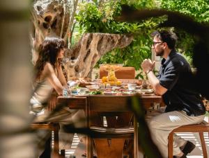a man and a woman sitting at a table at Fiora Alacati in Alaçatı