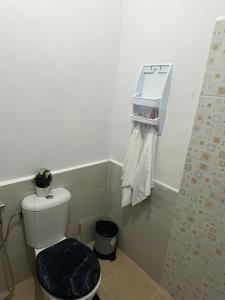 a bathroom with a toilet with a plant on it at Dar Ifrane in Ifrane