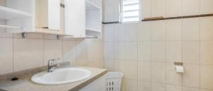 a bathroom with a sink and a toilet at Wayaca Mini Resort in Willemstad +6 photos