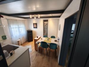 a kitchen and dining room with a table and chairs at Stephan house in Tremblay-En-France