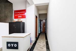 a corridor of an office with a white wall at HOTEL O RAHAN APPARTMENT in New Town