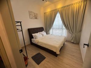 a small bedroom with a bed and a window at Piccadilly Greentown Ipoh by Jun - City Views in Ipoh +41 photos