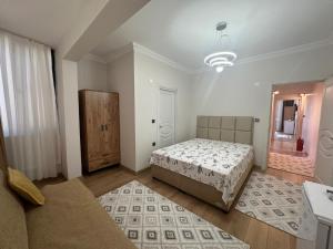 a bedroom with a bed and a mirror at Mürefte Suite in Tekirdağ +4 photos