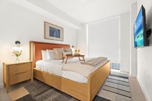 a bedroom with a large bed and a tv at 1Bd Top Location Downtown Miami in Miami +56 photos
