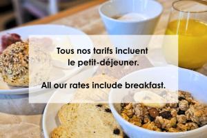 a table topped with plates of food and drinks at Setclub Hôtel & Spa Aix-en-Provence in Aix-en-Provence