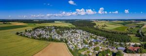an aerial view of a village in the middle of a field at Mobilheim in Laichingen