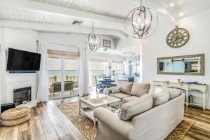 a living room with a couch and a fireplace at CJ286FLR LUX-Parrotfish Point in Cudjoe Key