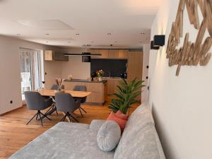 a living room with a couch and a table at Apartment Bergliebe in Sellrain