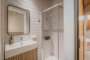 a bathroom with a sink and a mirror and a shower at Casa Da Rita in Matapozuelos +22 photos