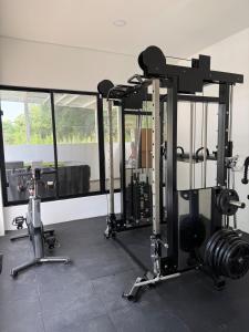 a gym with two tread machines and a window at Finca Exclusiva en Carmen de Apicalá in Carmen de Apicalá