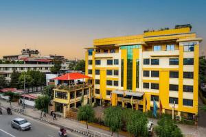 an overhead view of a yellow building on a city street at Yellow Pagoda Hotel in Kathmandu