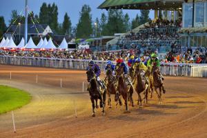 a group of horses racing on a race track at Maison de famille - Proche Centre Ville et Plage in Cabourg