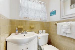 a bathroom with a sink and a toilet at CK03 Fisherman's Retreat in Conch Key +31 photos