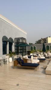 a group of couches and chairs on a patio at Macdonald Residence in Lagos