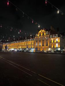 a large building with lights on it at night at Appartement hyper centre de Caen, refait à neuf, cosy in Caen