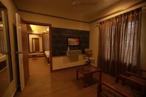 a room with a hallway with a table and a mirror at Fathima Residency in Pattanapuram