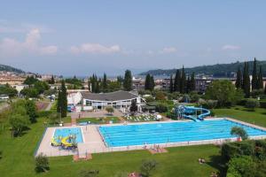 an overhead view of a large swimming pool at Garda MarANDGi Home Salo' in Salò